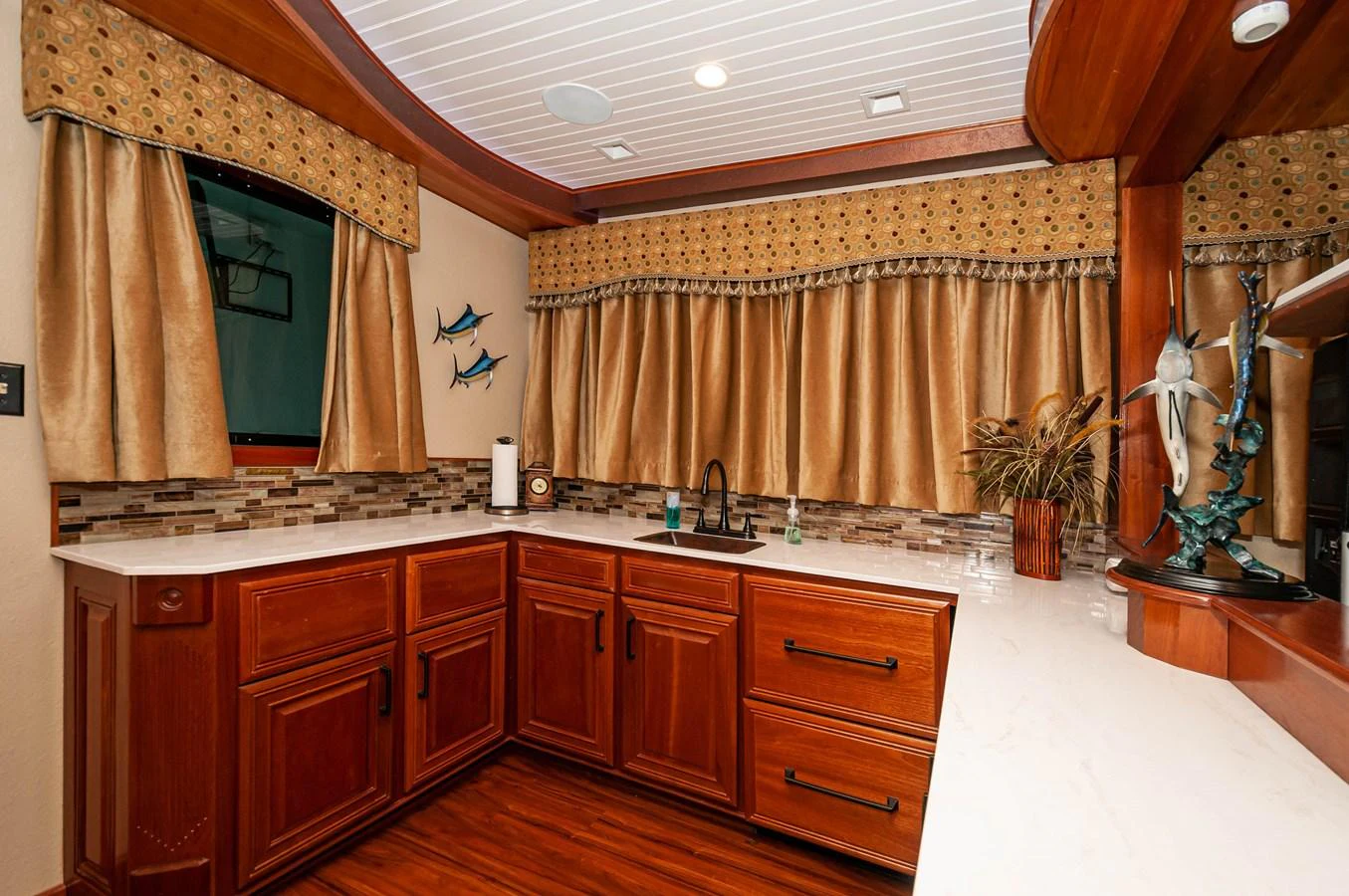 a bathroom with a sink and cabinets aboard LE COLBY JEAN Yacht for Sale
