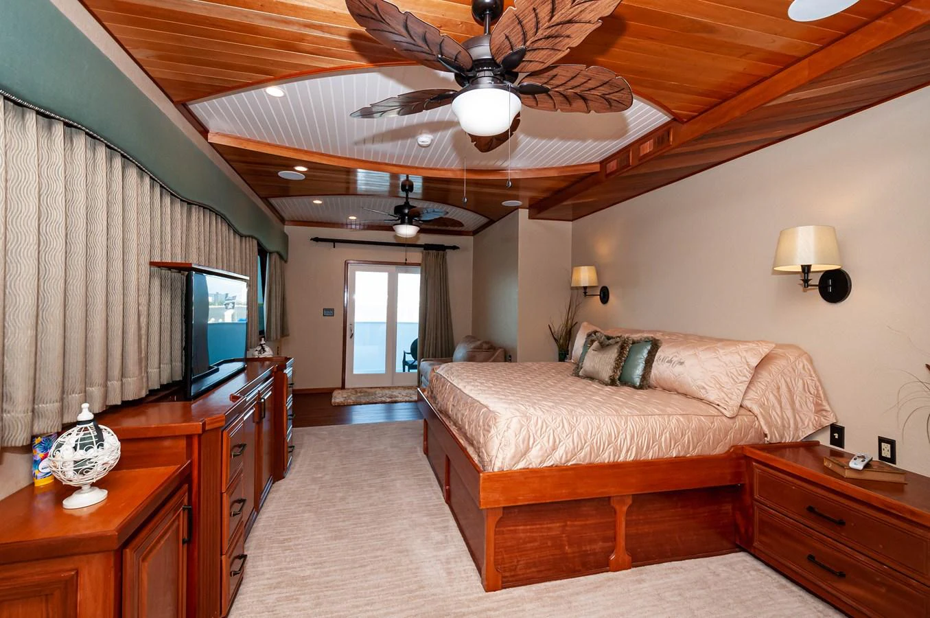 a bedroom with a bed and a television aboard LE COLBY JEAN Yacht for Sale