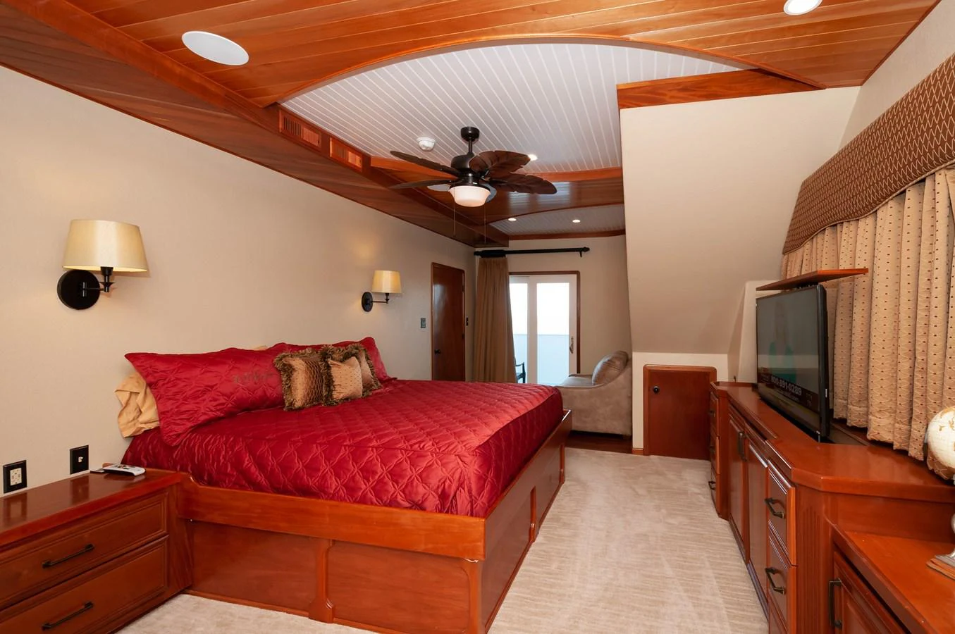 a bedroom with a bed and a television aboard LE COLBY JEAN Yacht for Sale