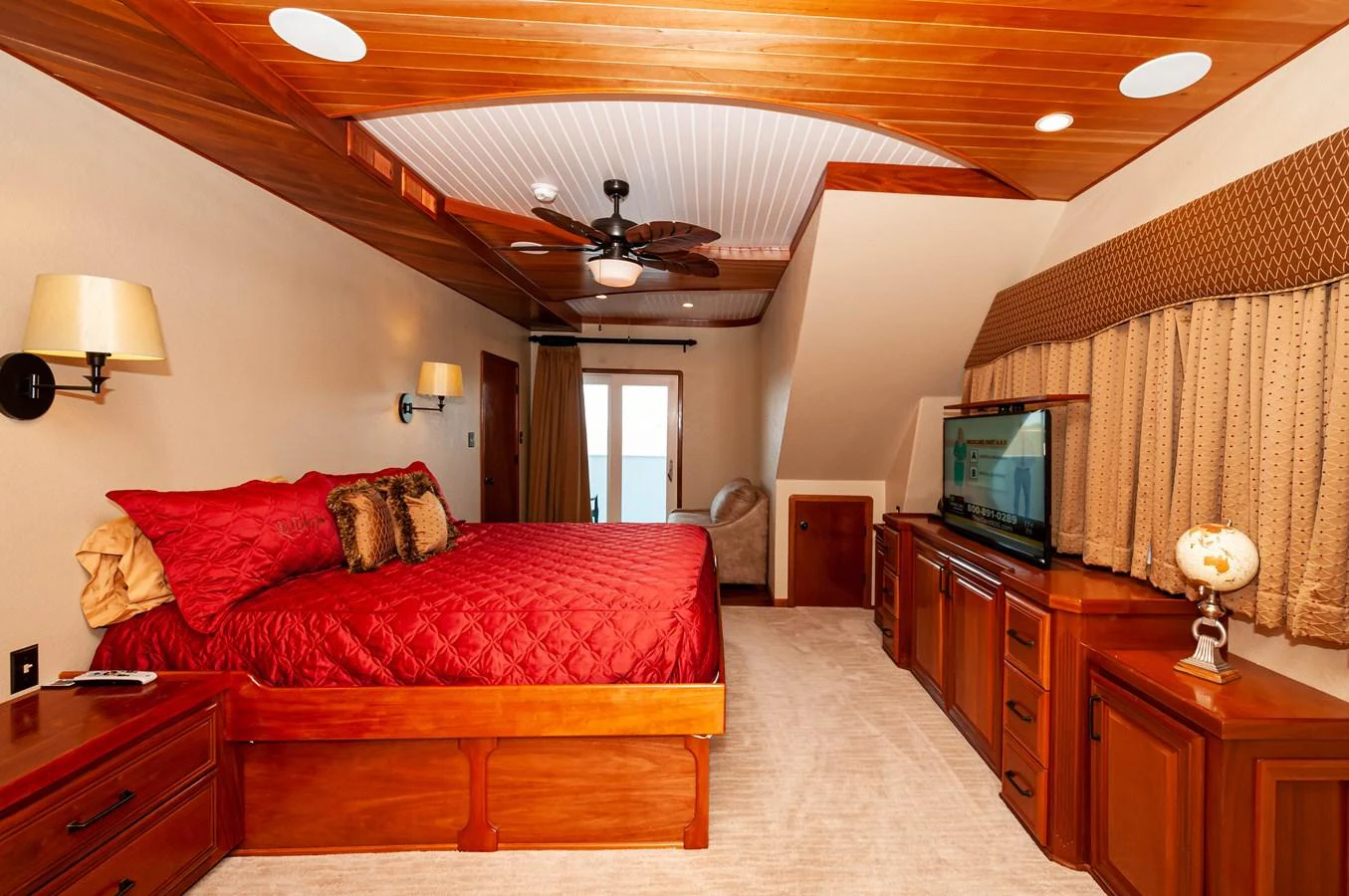 a bedroom with a bed and a television aboard LE COLBY JEAN Yacht for Sale