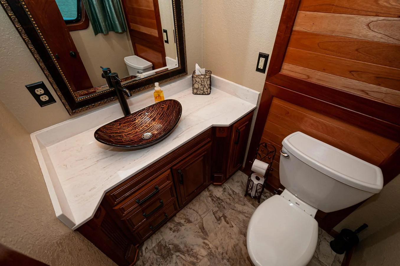 a bathroom with a sink and toilet aboard LE COLBY JEAN Yacht for Sale