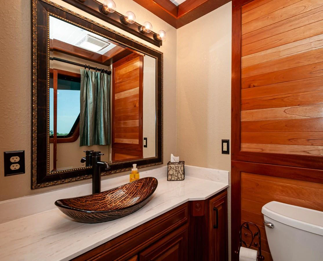 a bathroom with a mirror aboard LE COLBY JEAN Yacht for Sale