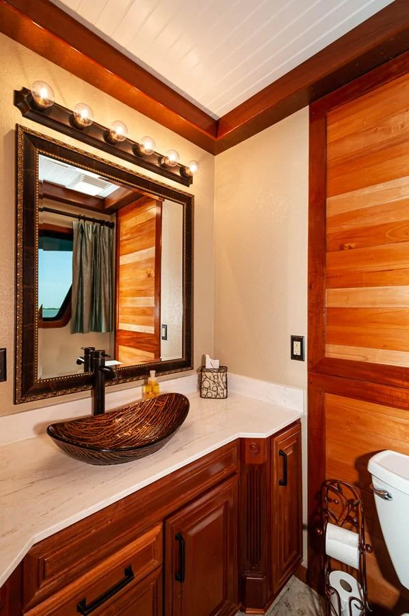 a bathroom with a mirror aboard LE COLBY JEAN Yacht for Sale