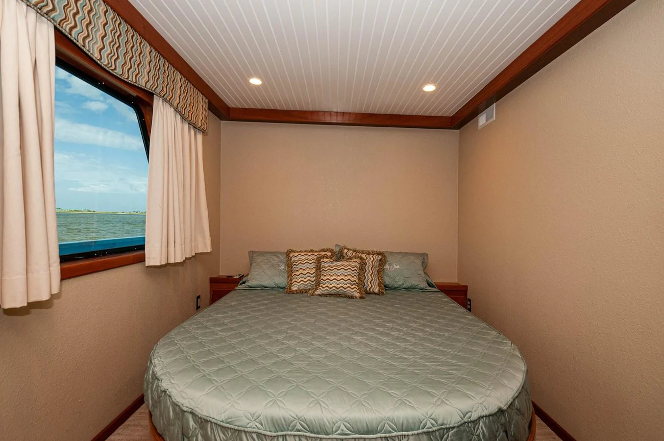 a bed in a room aboard LE COLBY JEAN Yacht for Sale