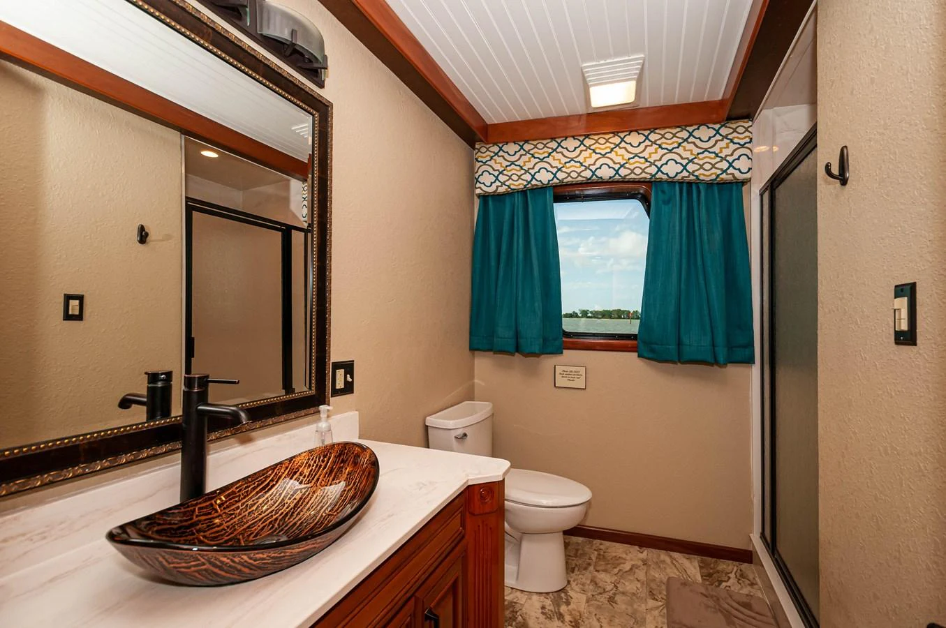 a bathroom with a sink and a toilet aboard LE COLBY JEAN Yacht for Sale