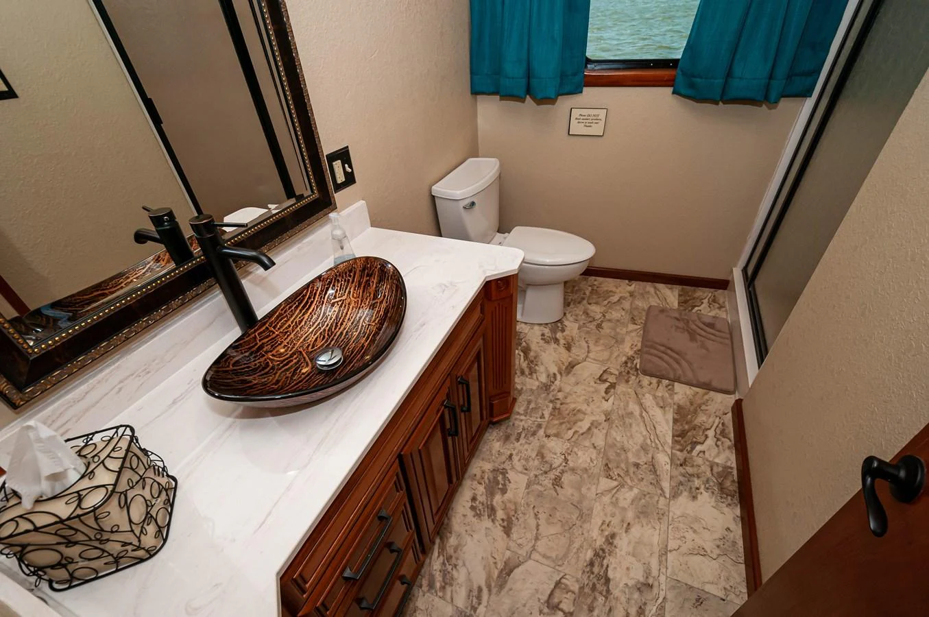 a bathroom with a sink toilet and a mirror aboard LE COLBY JEAN Yacht for Sale