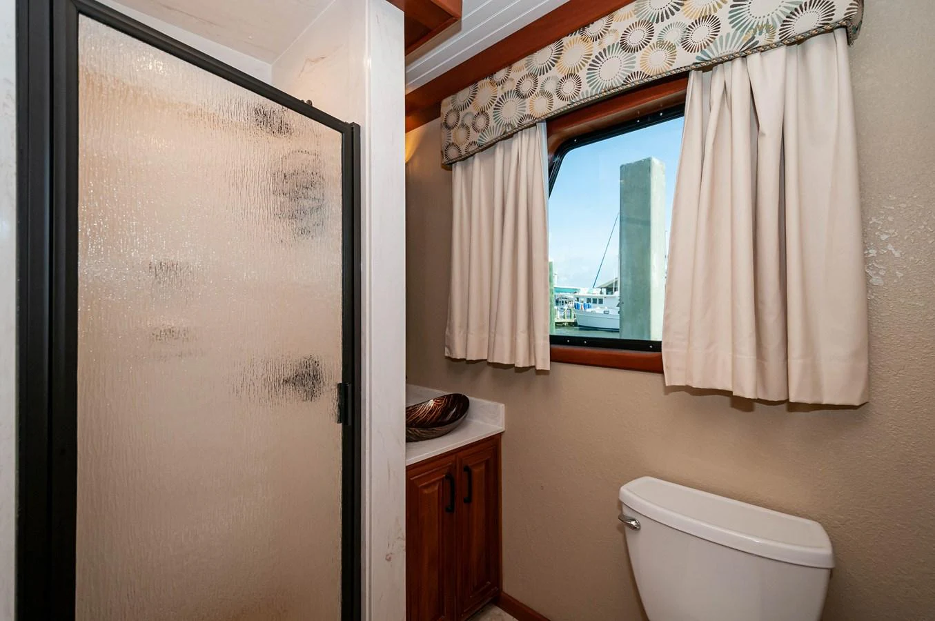 a bathroom with a toilet and a sink aboard LE COLBY JEAN Yacht for Sale