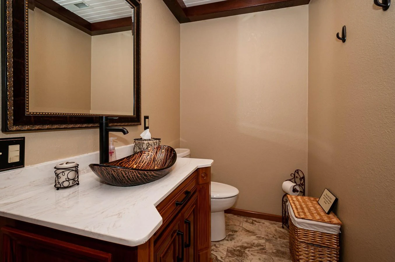 a bathroom with a basket and a mirror aboard LE COLBY JEAN Yacht for Sale