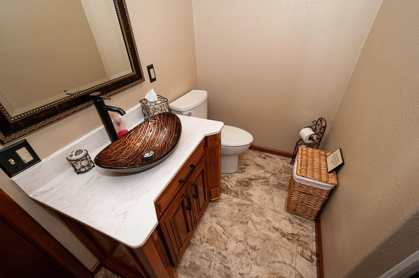 a bathroom with a basket and toilet aboard LE COLBY JEAN Yacht for Sale