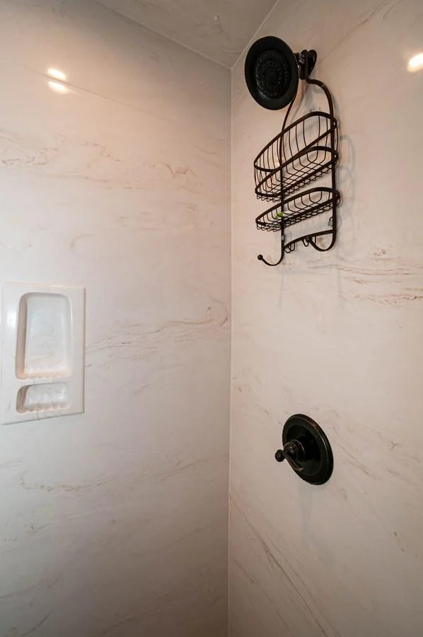 a white wall with a wire rack and a fan aboard LE COLBY JEAN Yacht for Sale