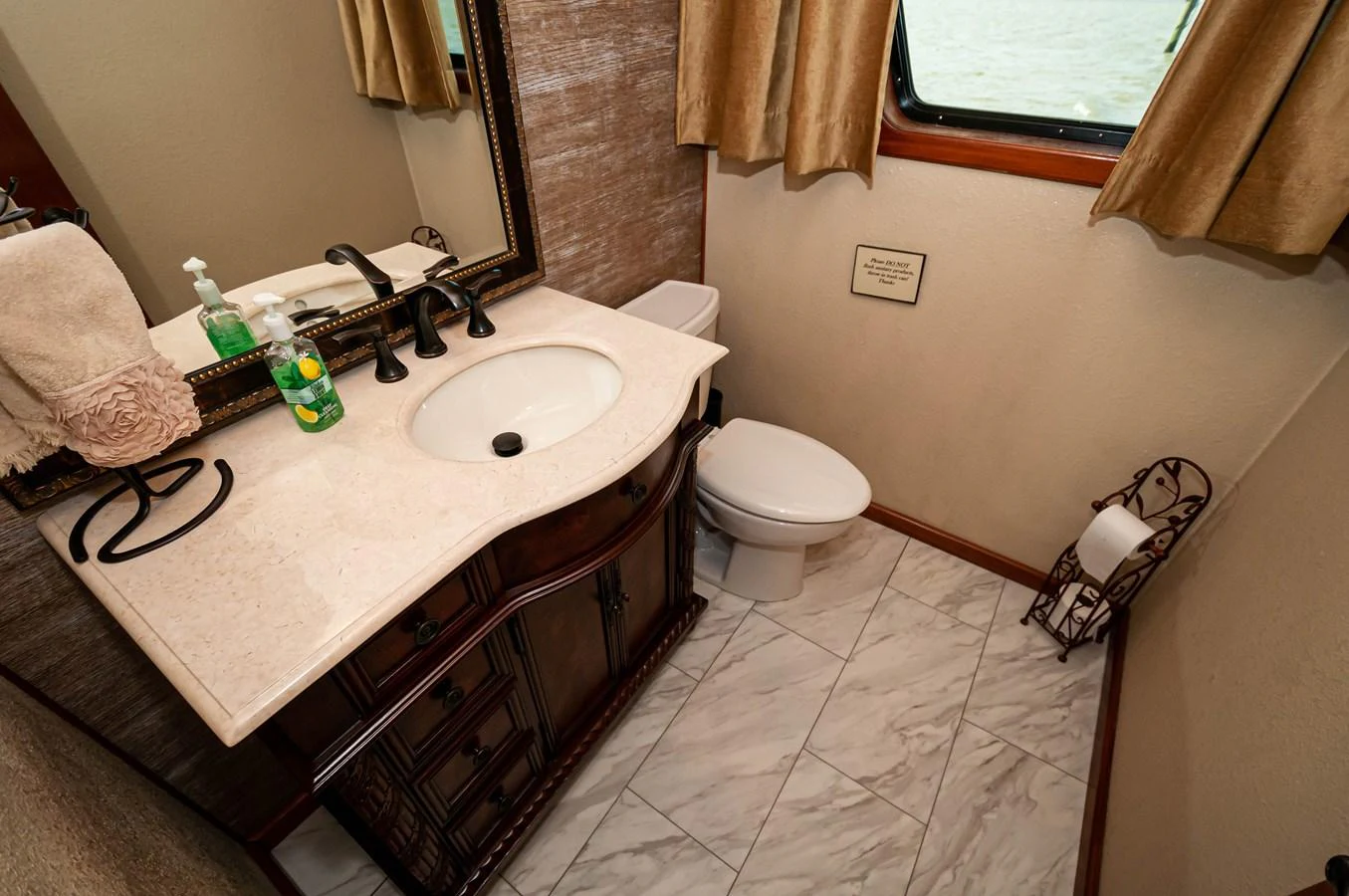 a bathroom with a sink and toilet aboard LE COLBY JEAN Yacht for Sale