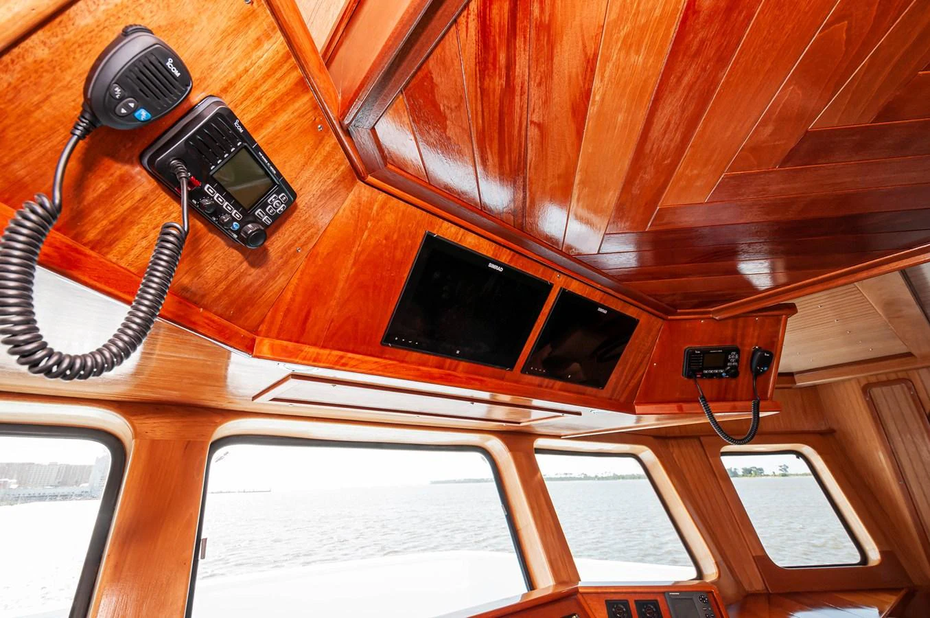 a black device on a wooden surface aboard LE COLBY JEAN Yacht for Sale