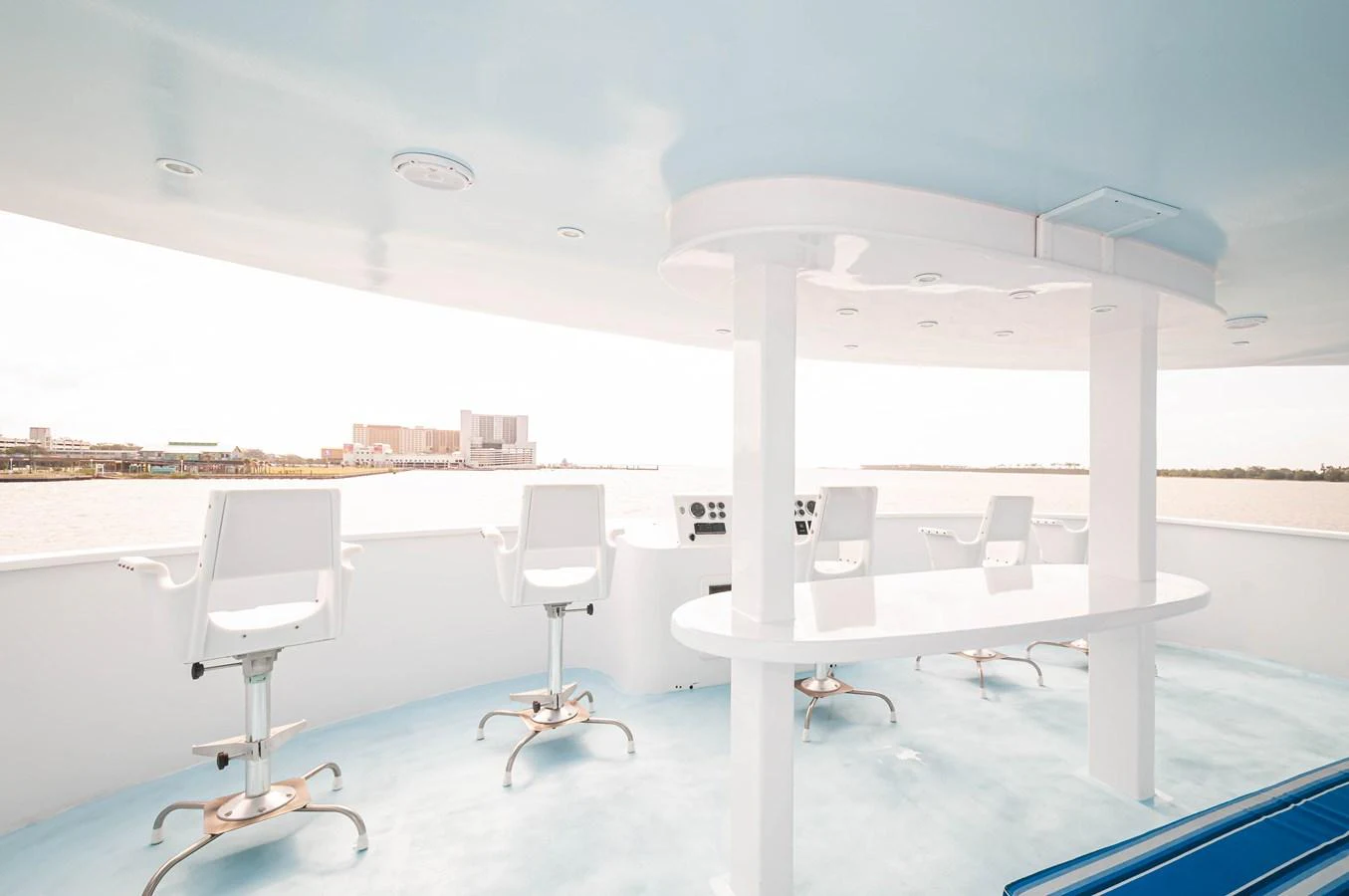 a room with tables and chairs aboard LE COLBY JEAN Yacht for Sale