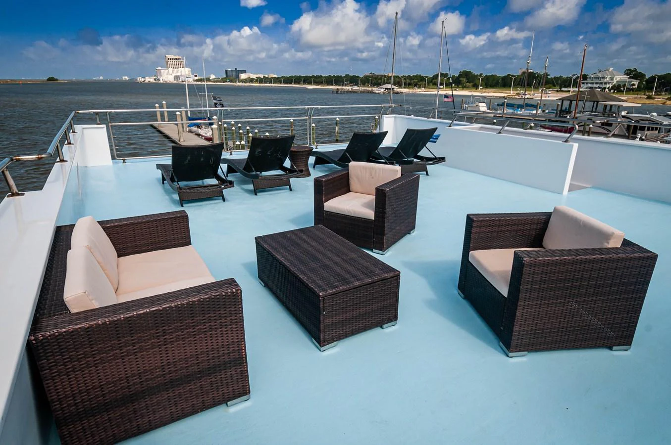 a pool with lounge chairs aboard LE COLBY JEAN Yacht for Sale