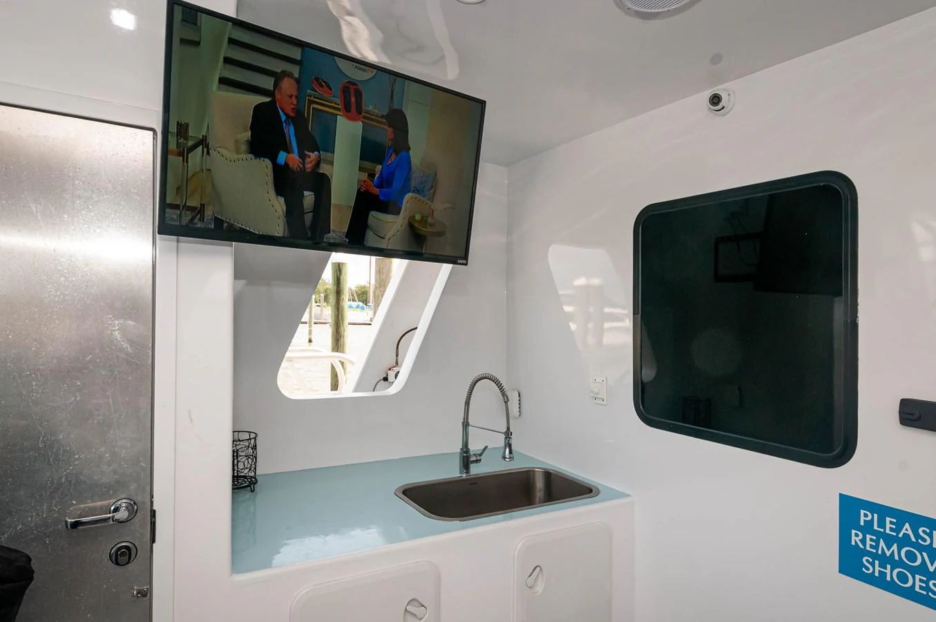 a bathroom with a sink and a mirror aboard LE COLBY JEAN Yacht for Sale
