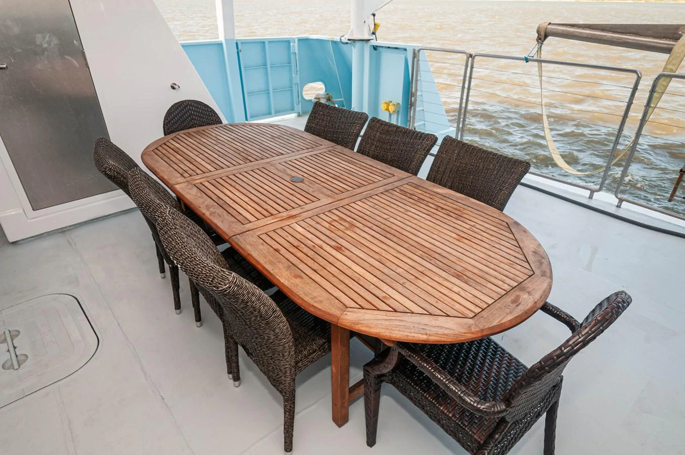 a table and chairs on a tile floor aboard LE COLBY JEAN Yacht for Sale