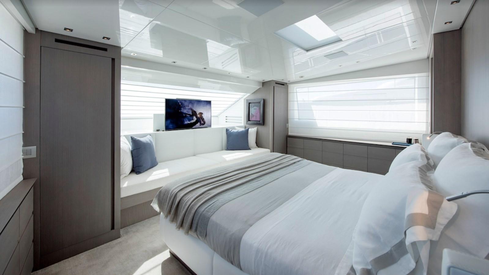 a room with a bed and a television aboard DINAIA Yacht for Sale