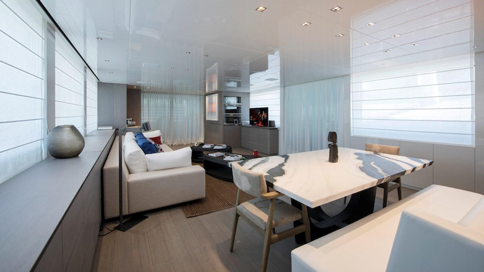 a room with a table and chairs aboard DINAIA Yacht for Sale