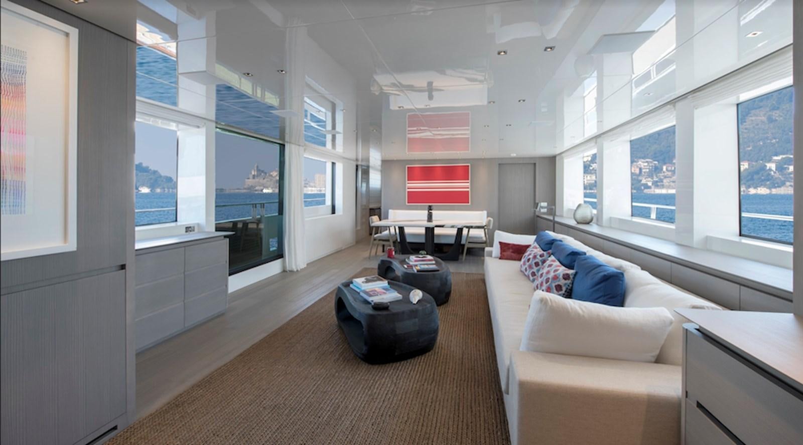 a living room with a large window aboard DINAIA Yacht for Sale