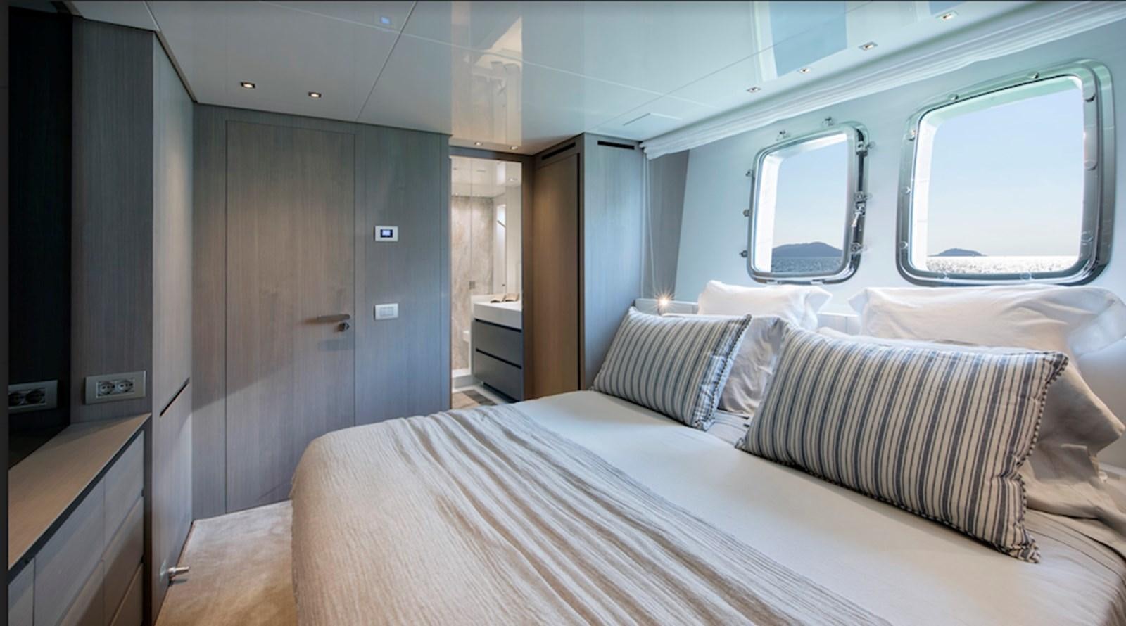 a bed in a room aboard DINAIA Yacht for Sale