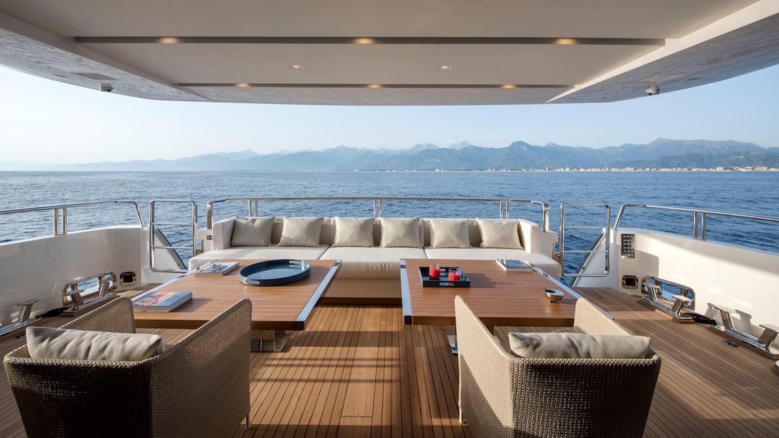 a large living room with a large body of water aboard SANLORENZO SL106 Yacht for Sale