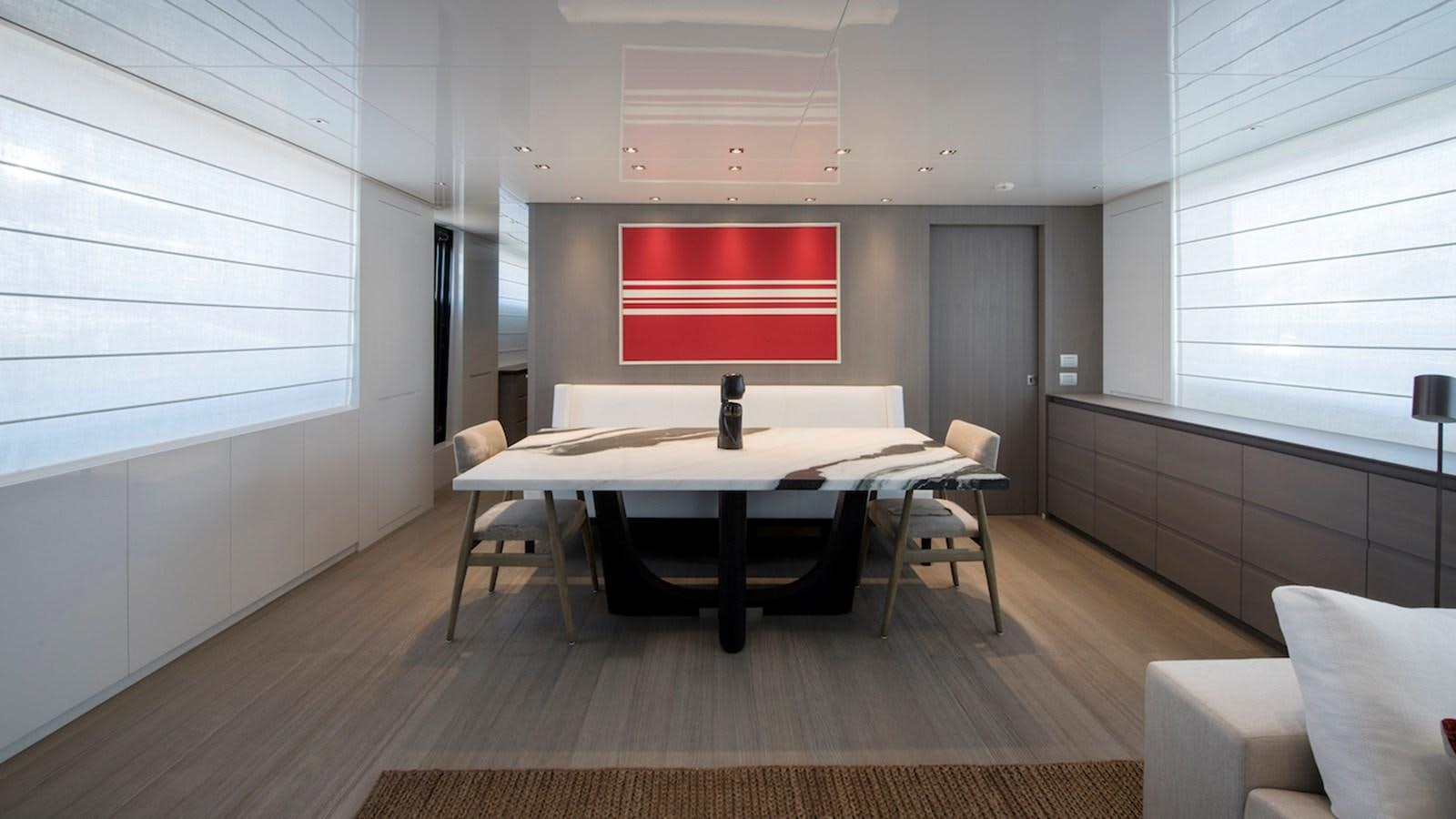 a room with a table and chairs aboard SANLORENZO SL106 Yacht for Sale