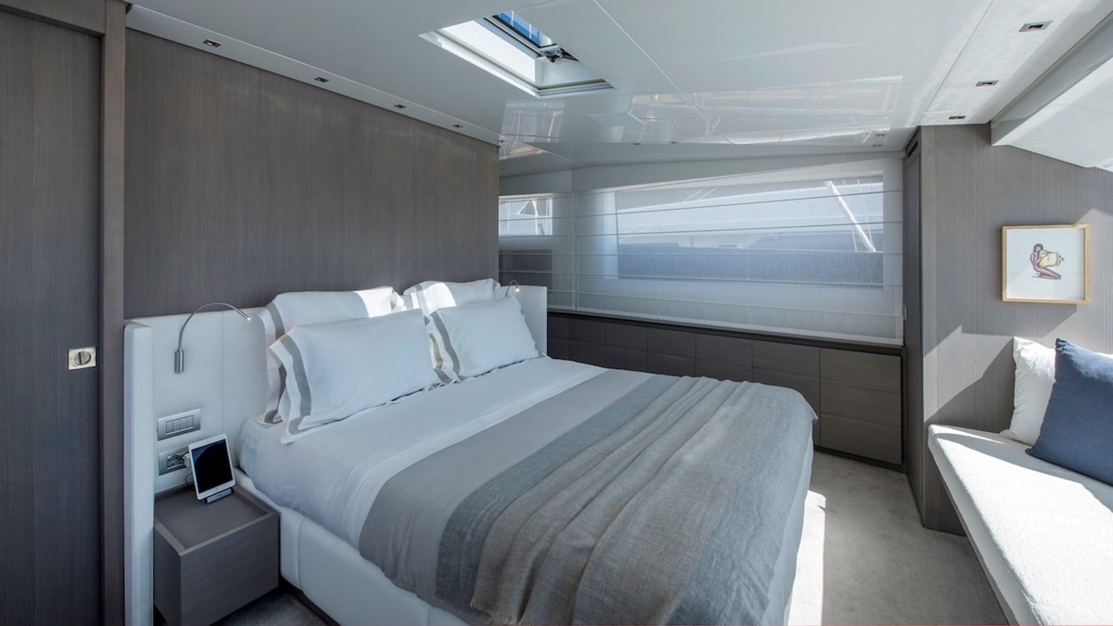 a room with a bed and a desk aboard SANLORENZO SL106 Yacht for Sale