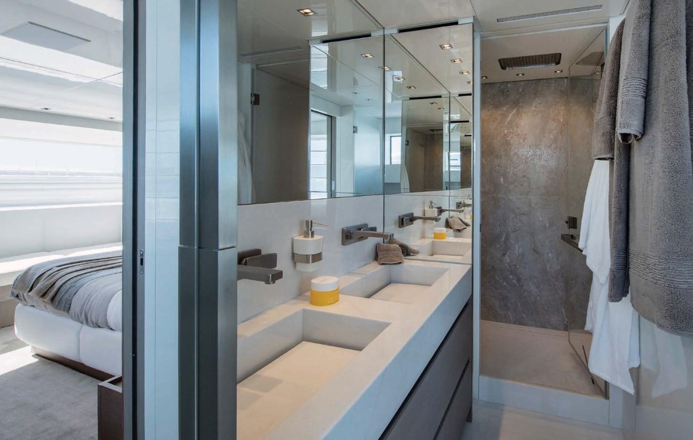 a bathroom with a sink and a mirror aboard SANLORENZO SL106 Yacht for Sale