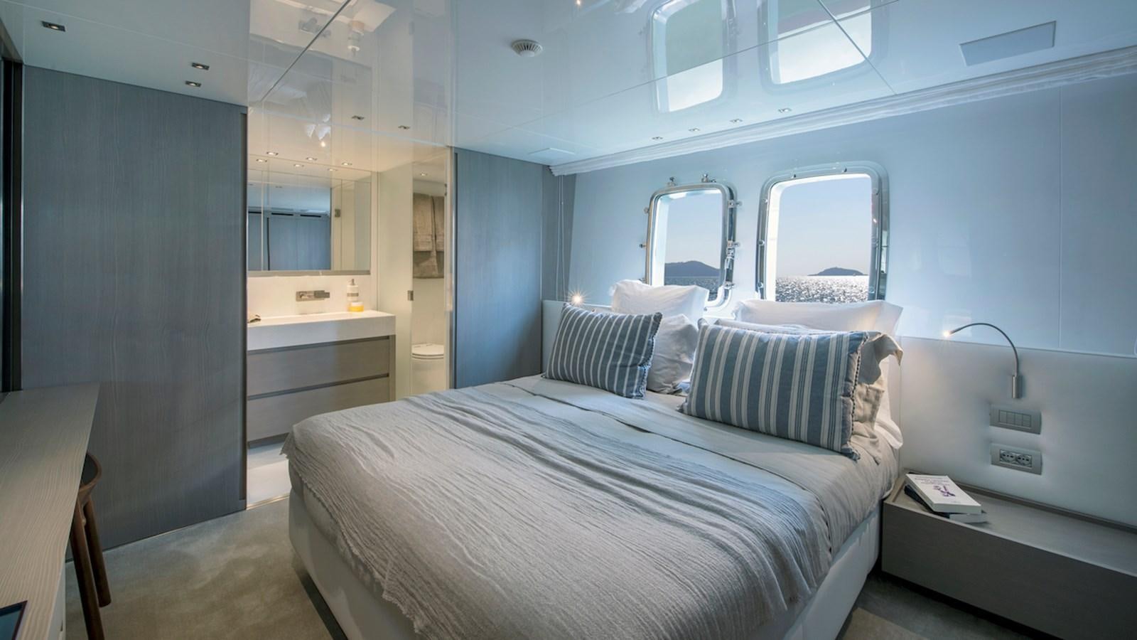 a bed in a room aboard SANLORENZO SL106 Yacht for Sale