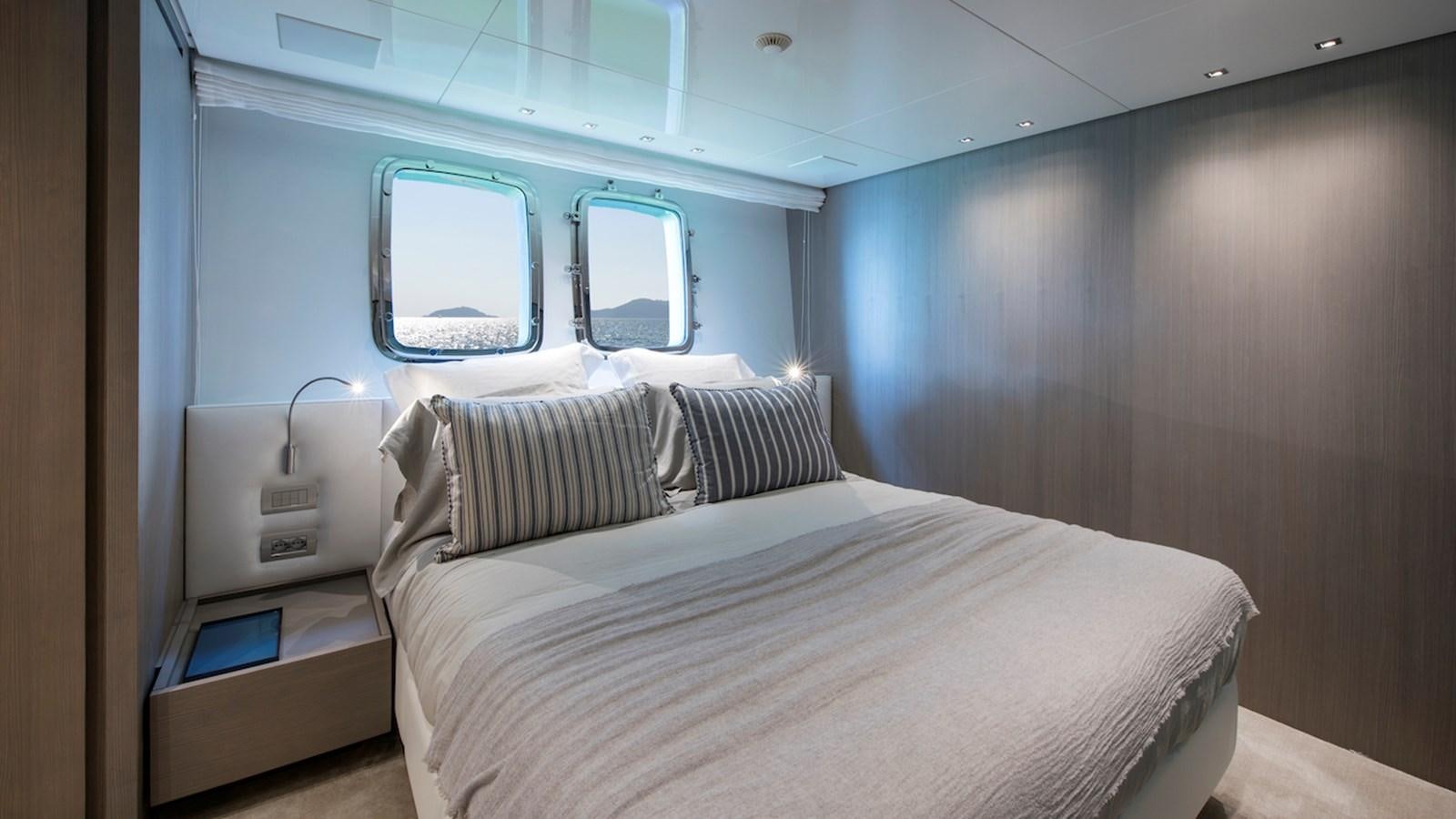 a bed in a room aboard SANLORENZO SL106 Yacht for Sale