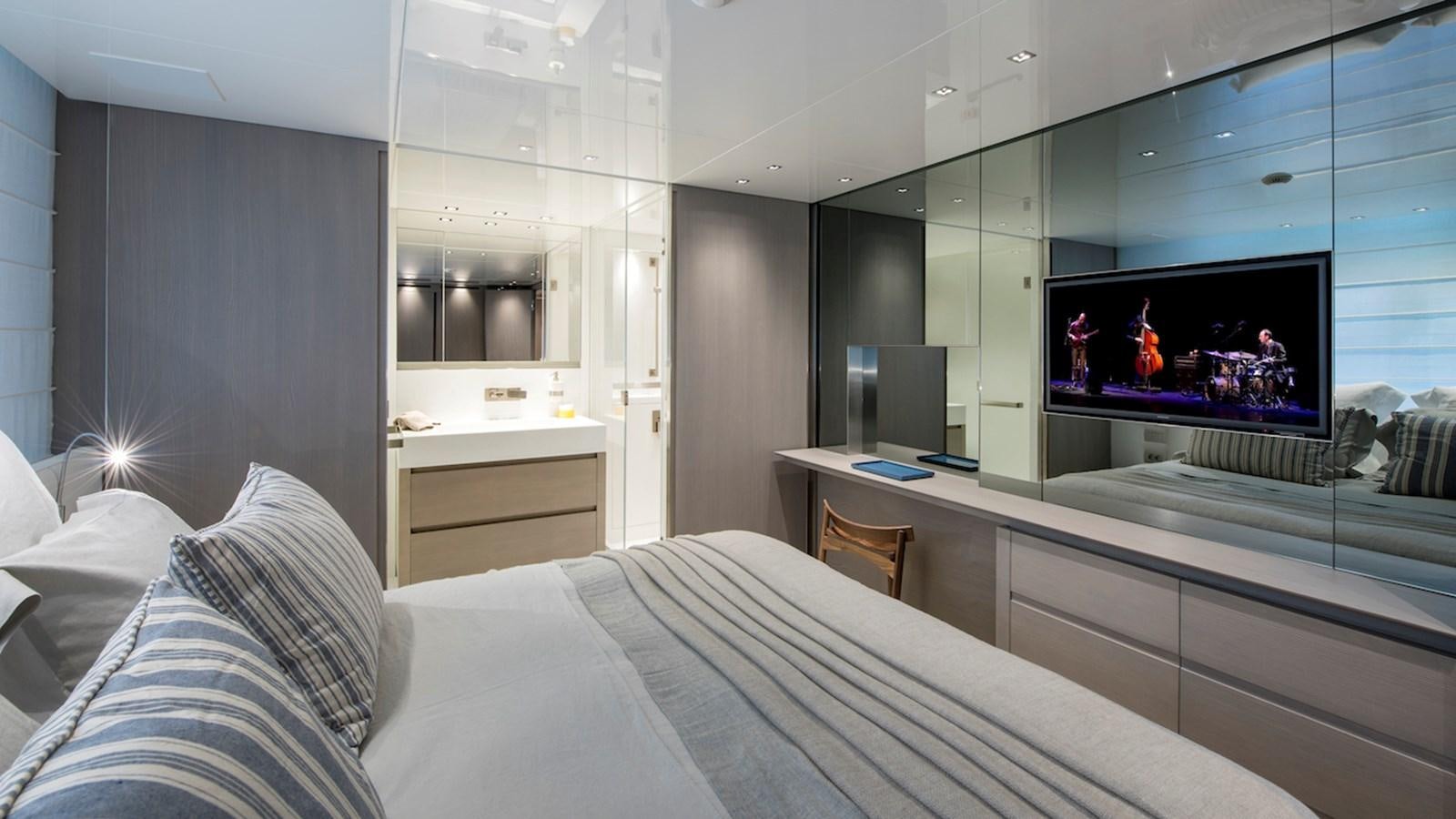 a room with a bed and a tv aboard SANLORENZO SL106 Yacht for Sale