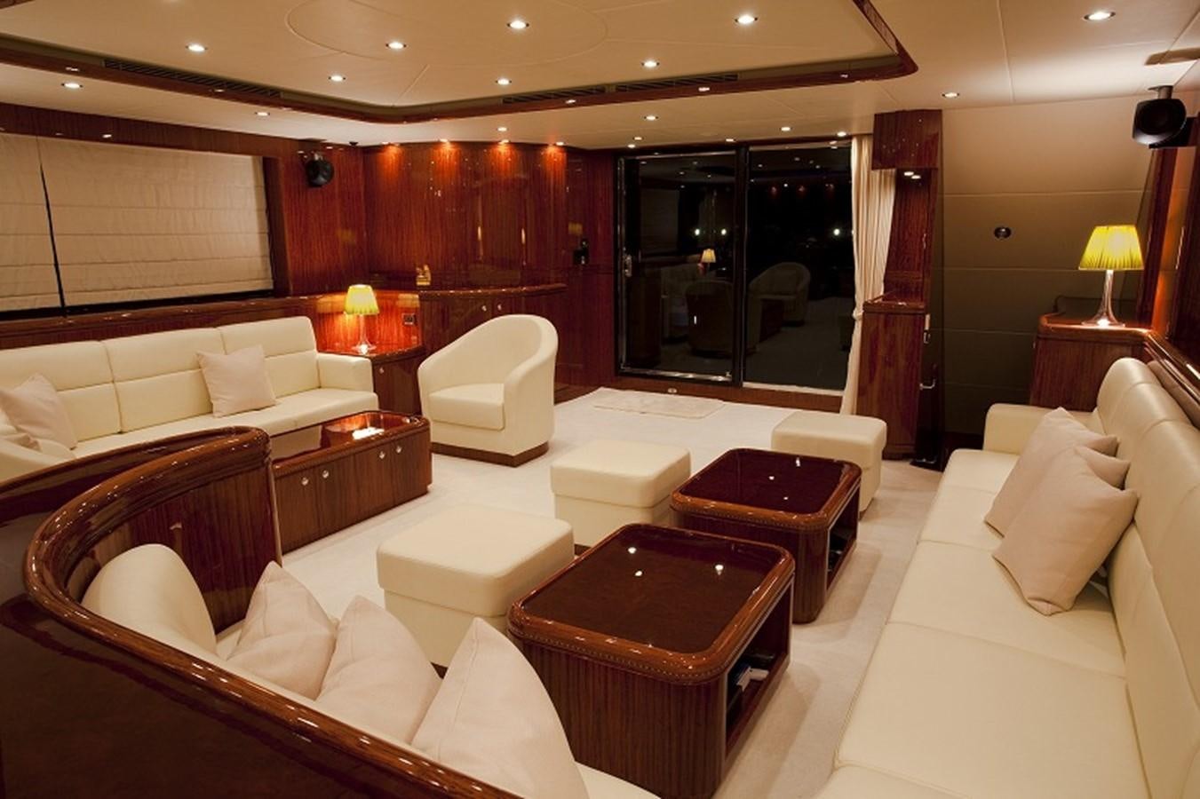 a large room with a couch and a table aboard QUEEN GRACE Yacht for Sale
