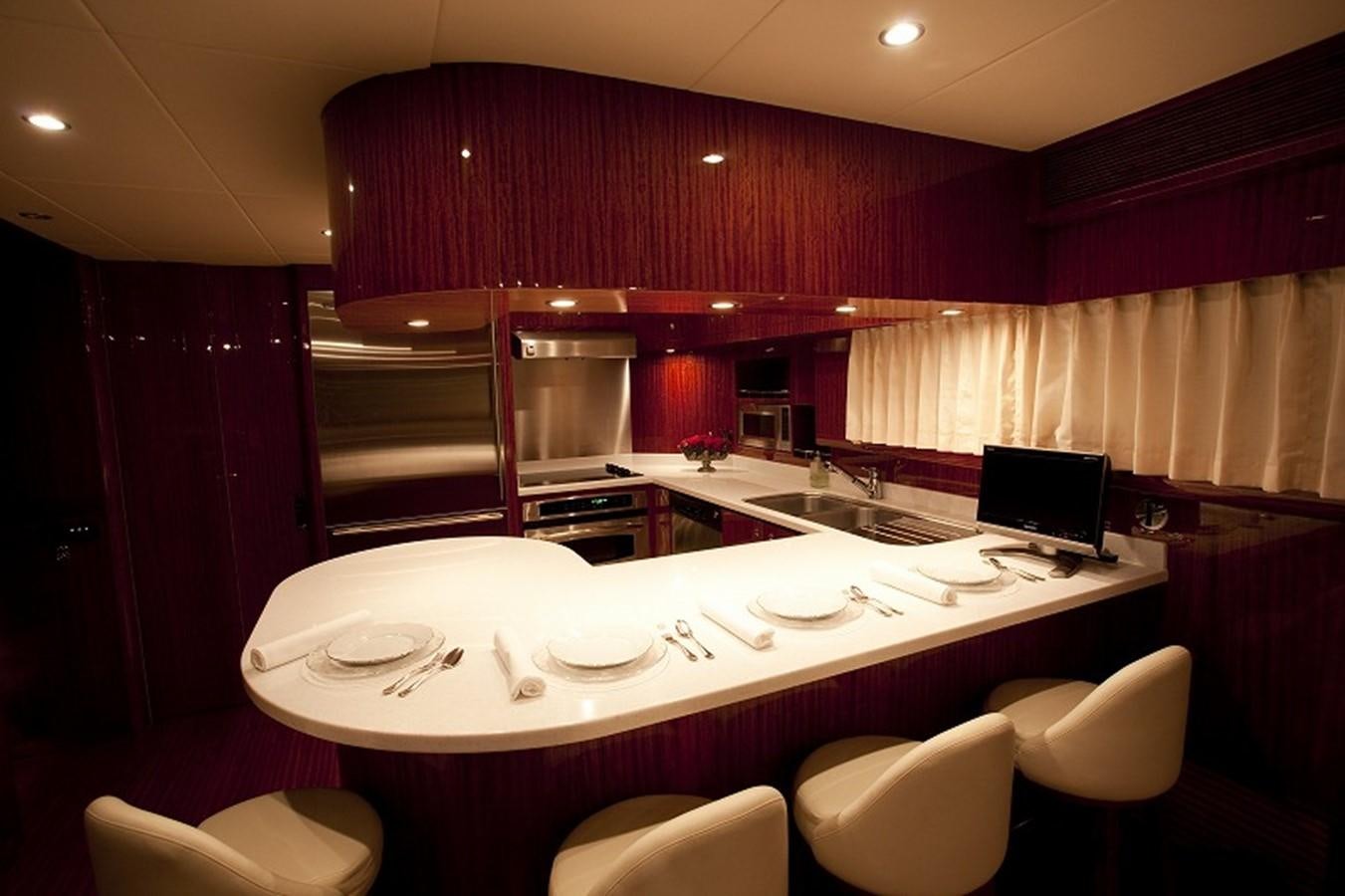 a large kitchen with a large table aboard QUEEN GRACE Yacht for Sale