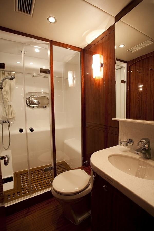 a bathroom with a glass shower aboard QUEEN GRACE Yacht for Sale