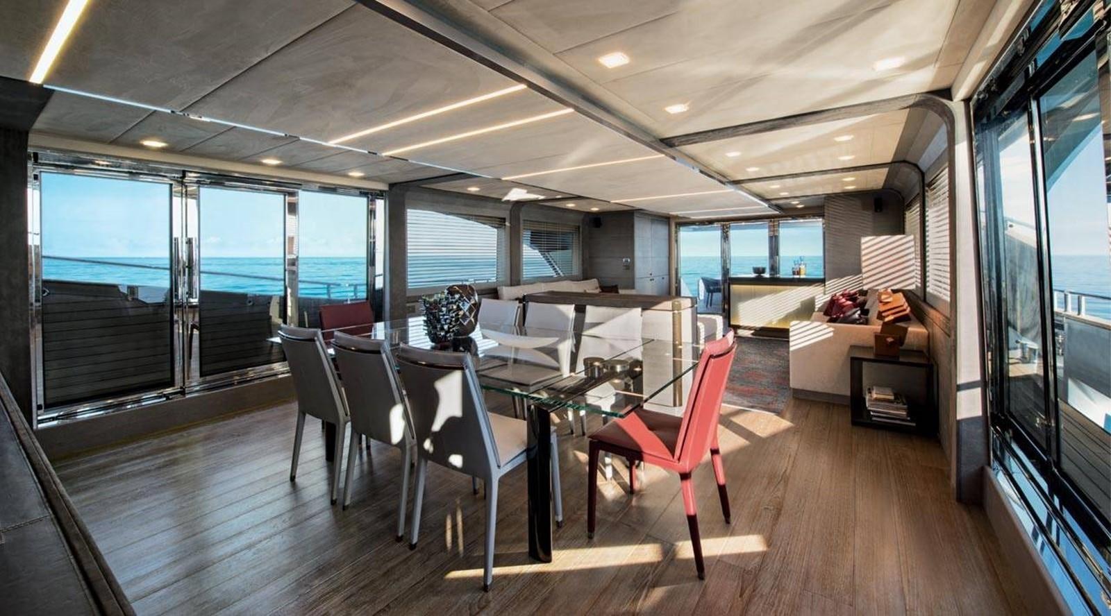 a room with a table and chairs aboard MONTE CARLO YACHTS MCY 105 Yacht for Sale