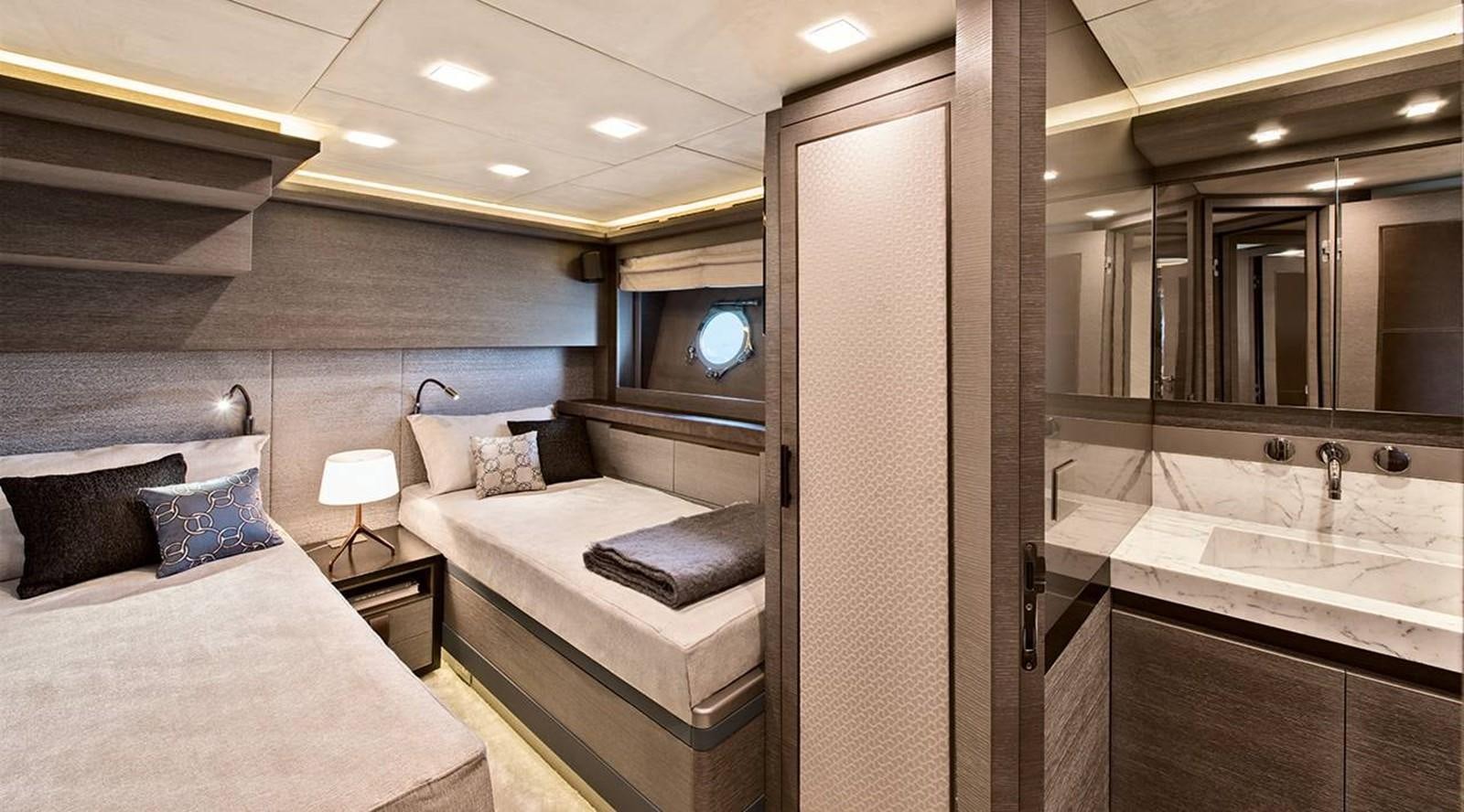 a bathroom with a bed and a sink aboard MONTE CARLO YACHTS MCY 105 Yacht for Sale