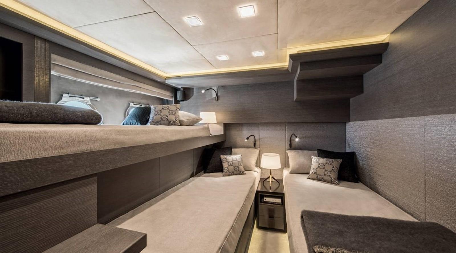 a room with a bed and a couch aboard MONTE CARLO YACHTS MCY 105 Yacht for Sale