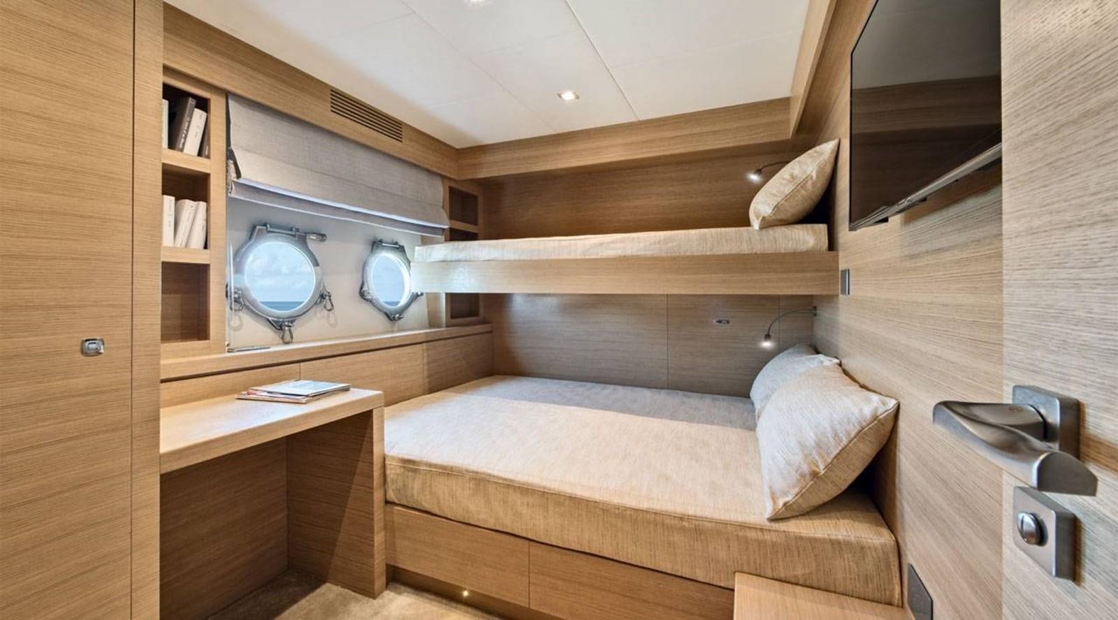 a bed with a television on top of it aboard MONTE CARLO YACHTS MCY 105 Yacht for Sale