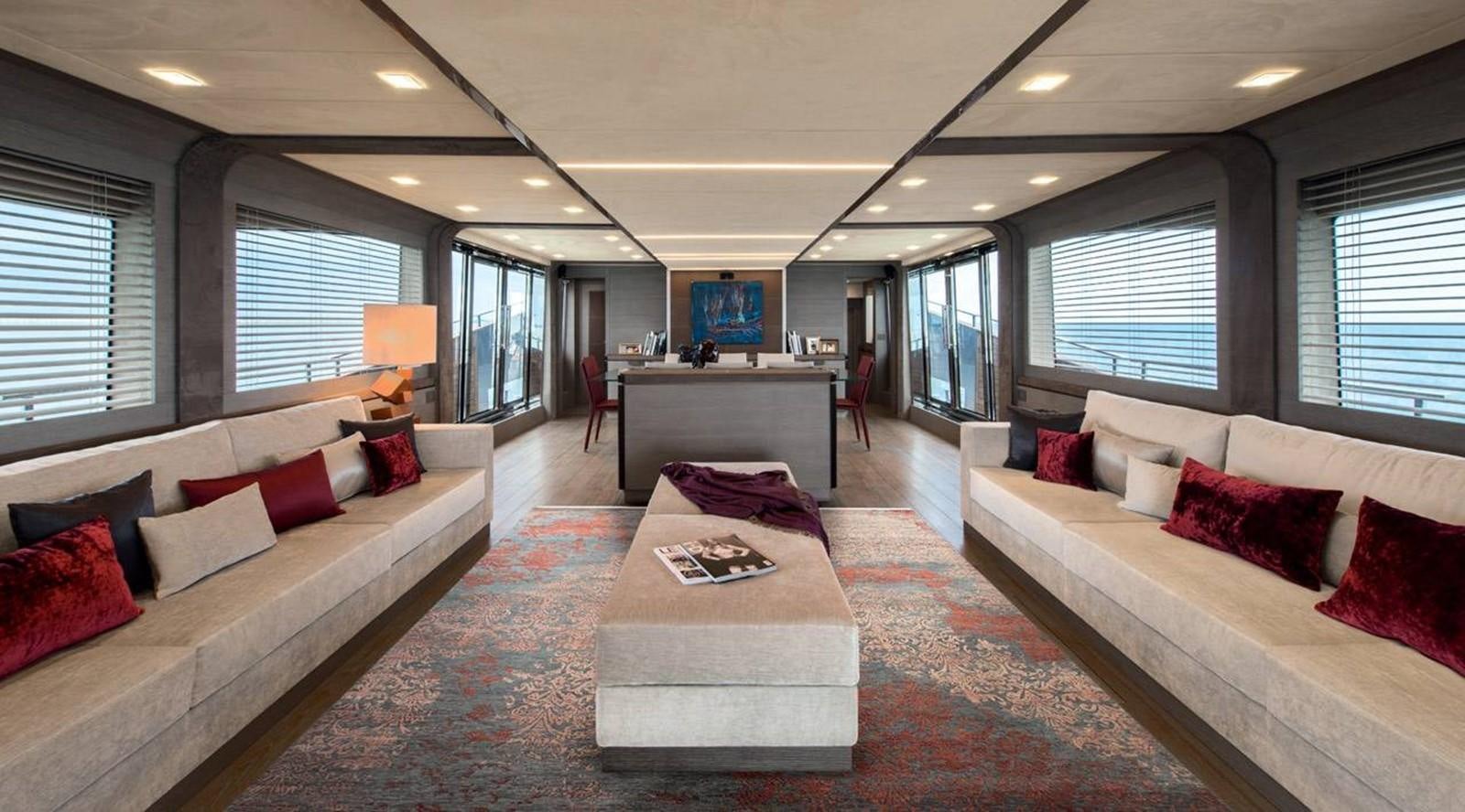 a large living room with a large bed and a large window aboard MONTE CARLO YACHTS MCY 105 Yacht for Sale