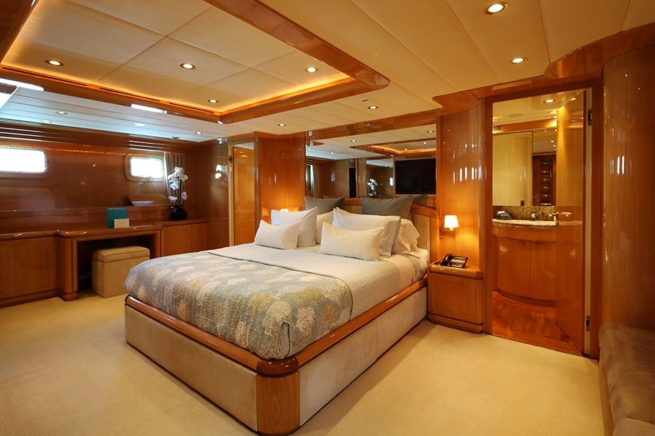 a hotel room with a bed aboard INDIGO Yacht for Sale