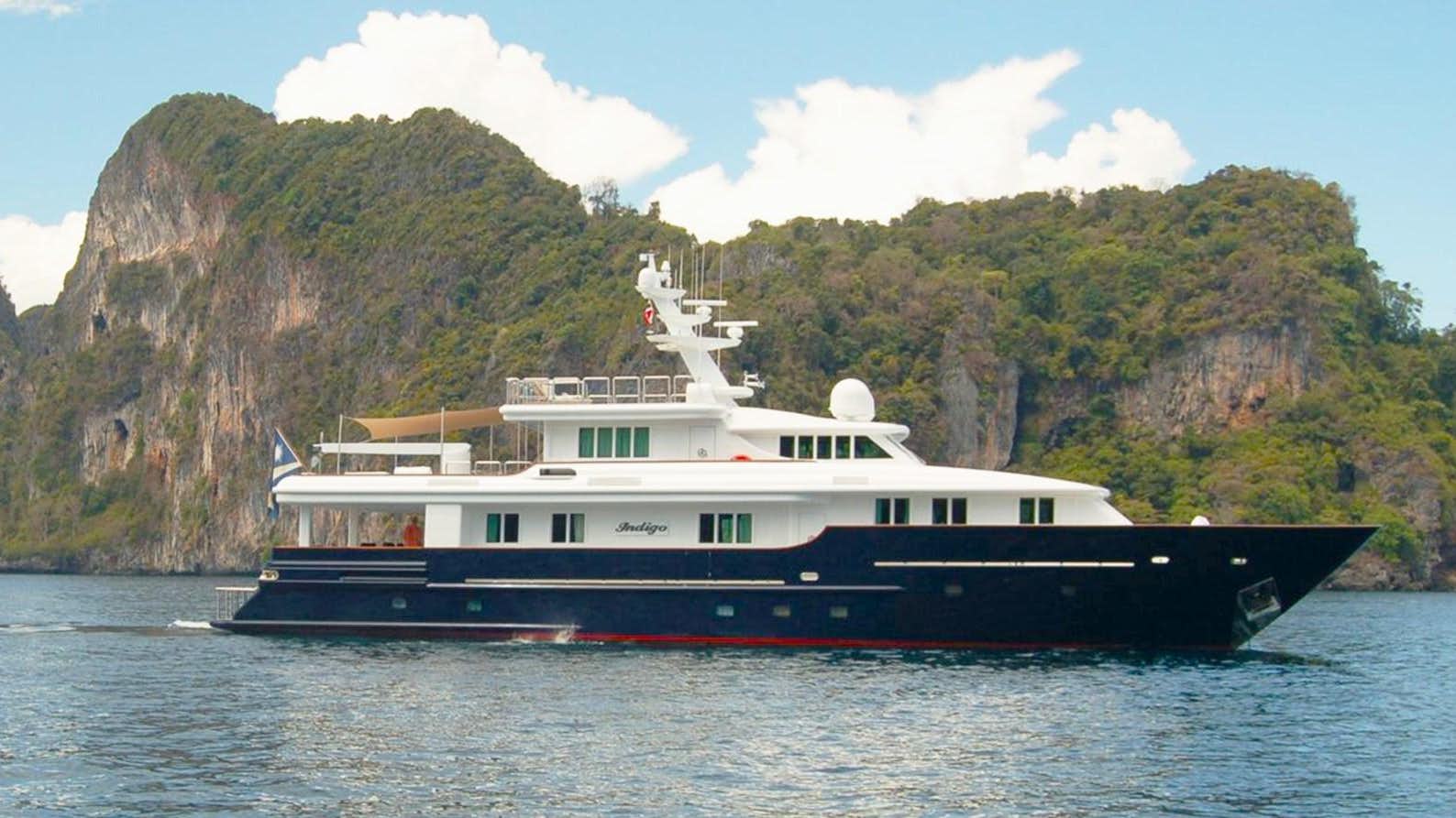 a large boat on the water aboard INDIGO Yacht for Sale