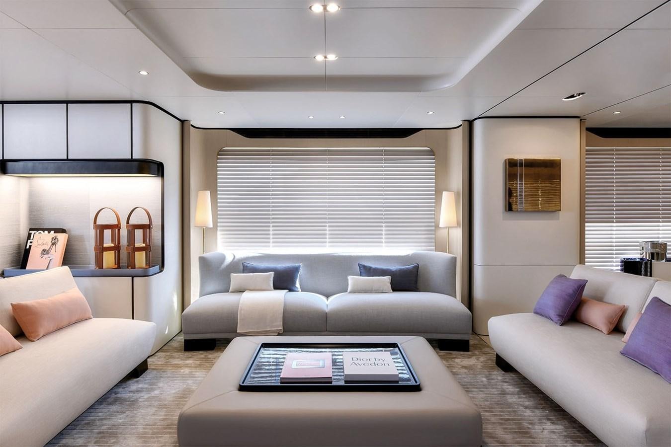a living room with white couches aboard ALBA Yacht for Sale