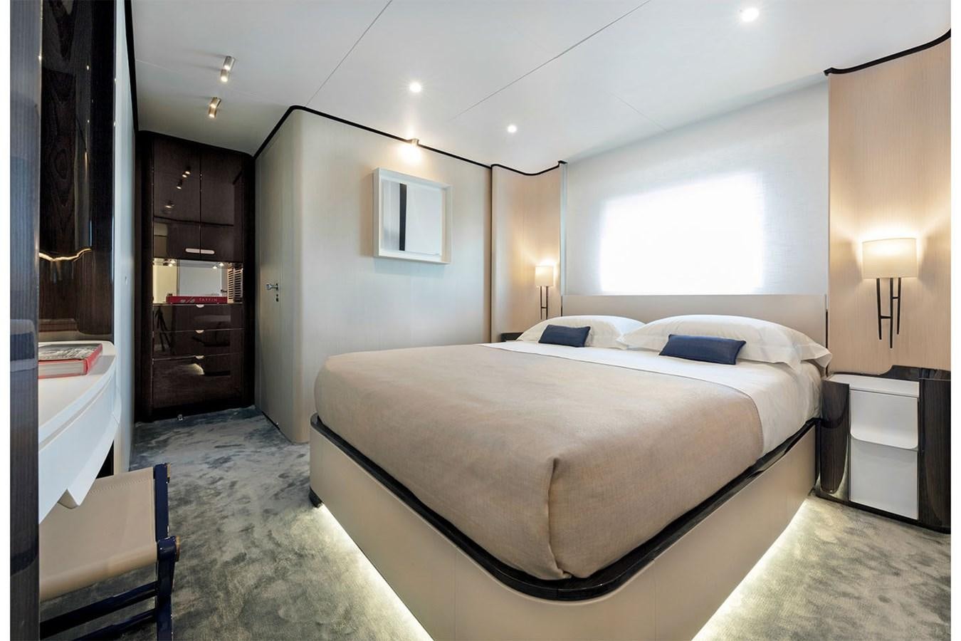 a bedroom with a bed and a desk aboard ALBA Yacht for Sale