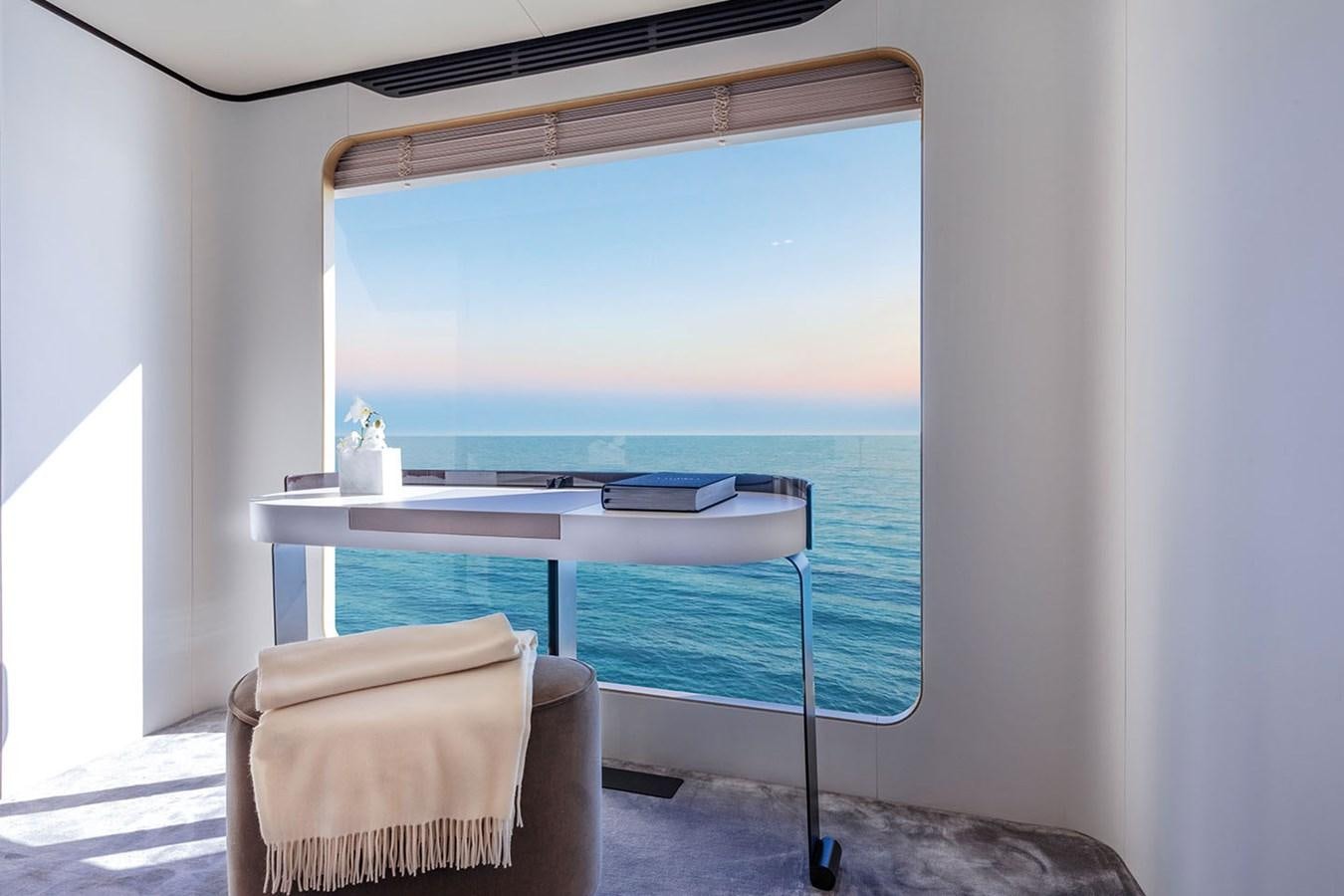 a room with a table and chairs aboard ALBA Yacht for Sale