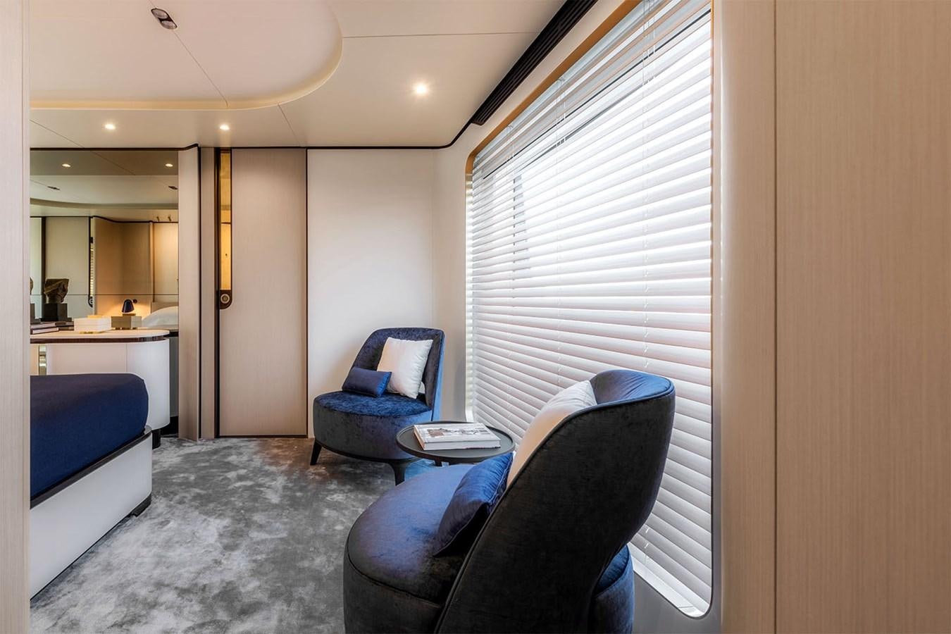 a room with a bed and a desk aboard ALBA Yacht for Sale