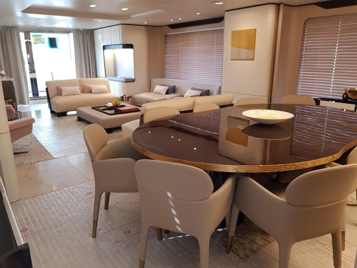 a living room with a table and chairs aboard ALBA Yacht for Sale