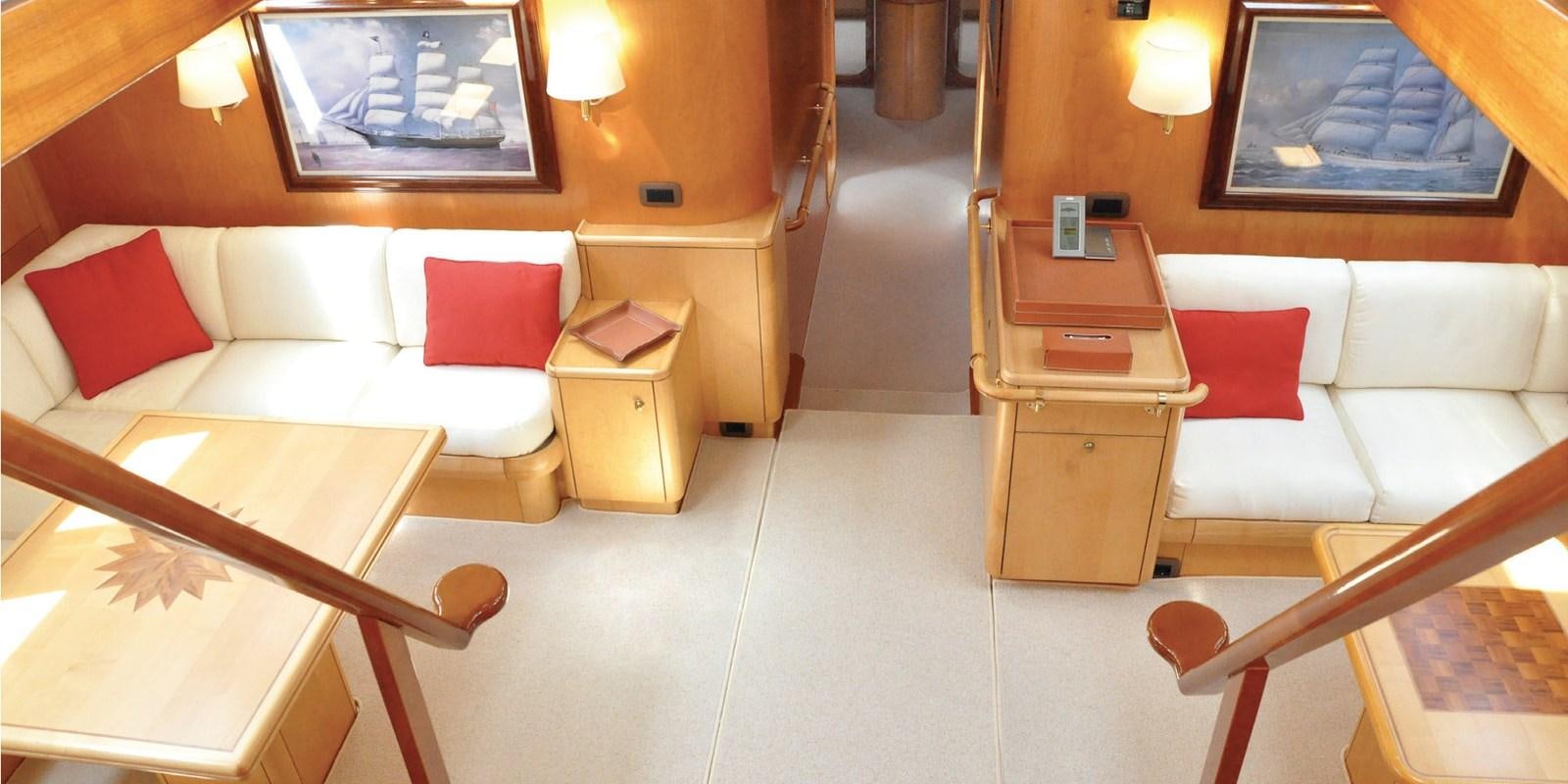 a room with a bed and desk aboard ASAHI Yacht for Sale