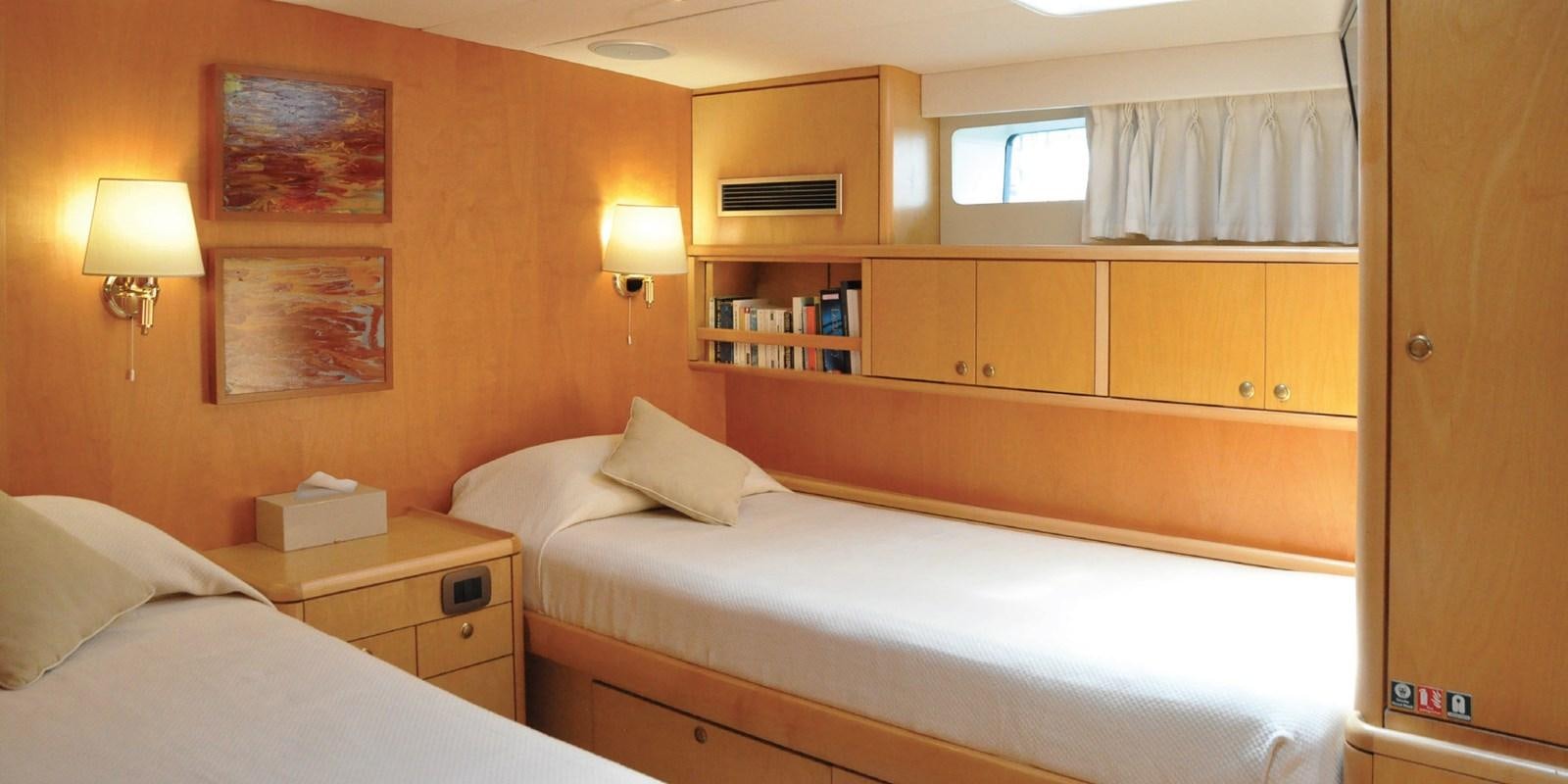 a room with two beds aboard ASAHI Yacht for Sale
