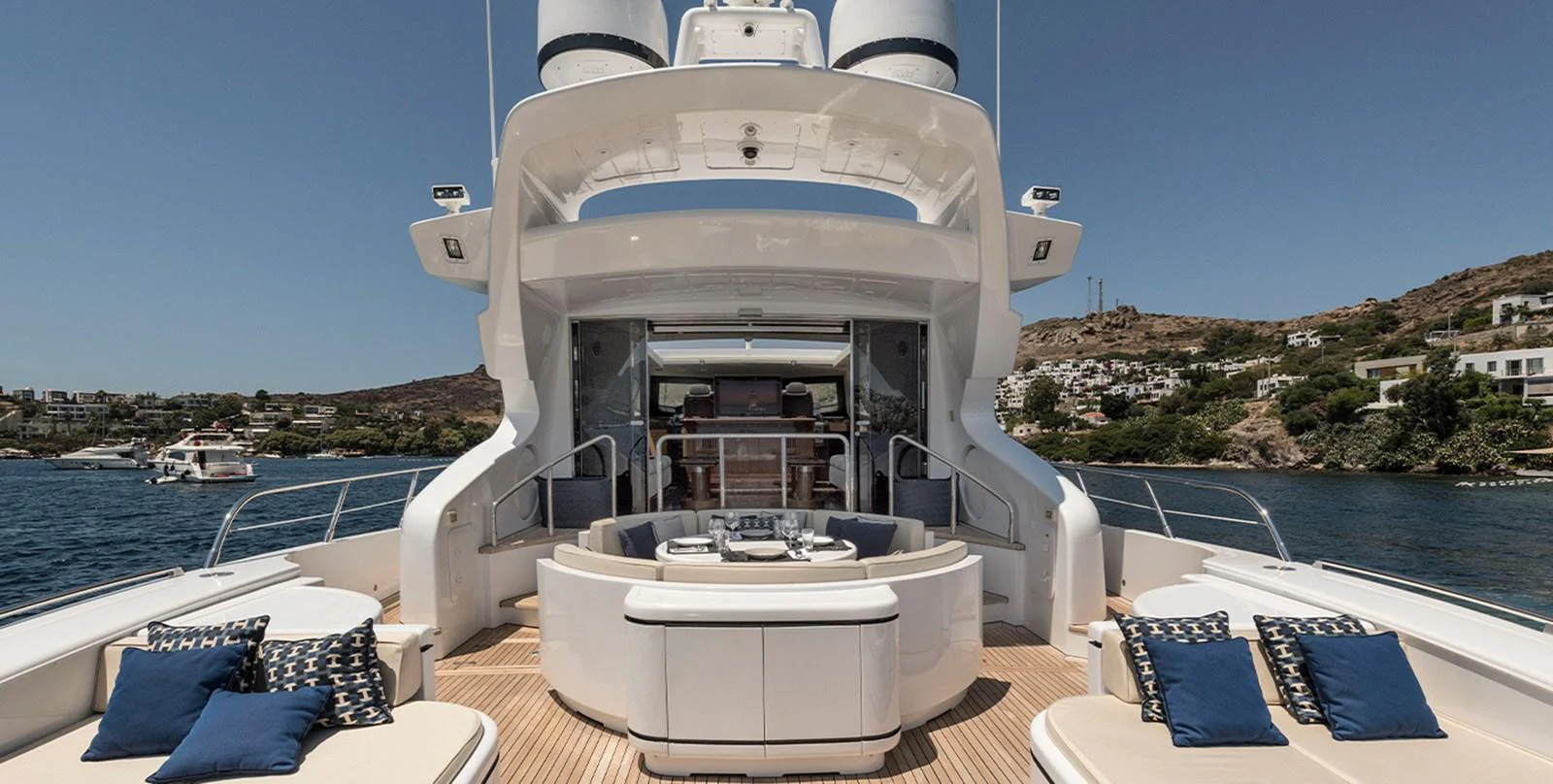 a large white boat on a deck aboard DANUSH Yacht for Sale