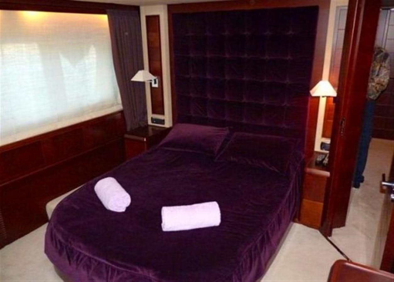 a bed with black sheets aboard VIVERE Yacht for Sale